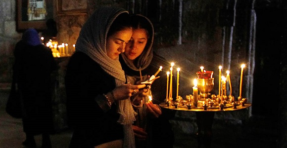 Young women pray at the Sevtitskhoveli Cathedral, Mtskheta, Georgia (David Mdzinarishvili,Reuters)
